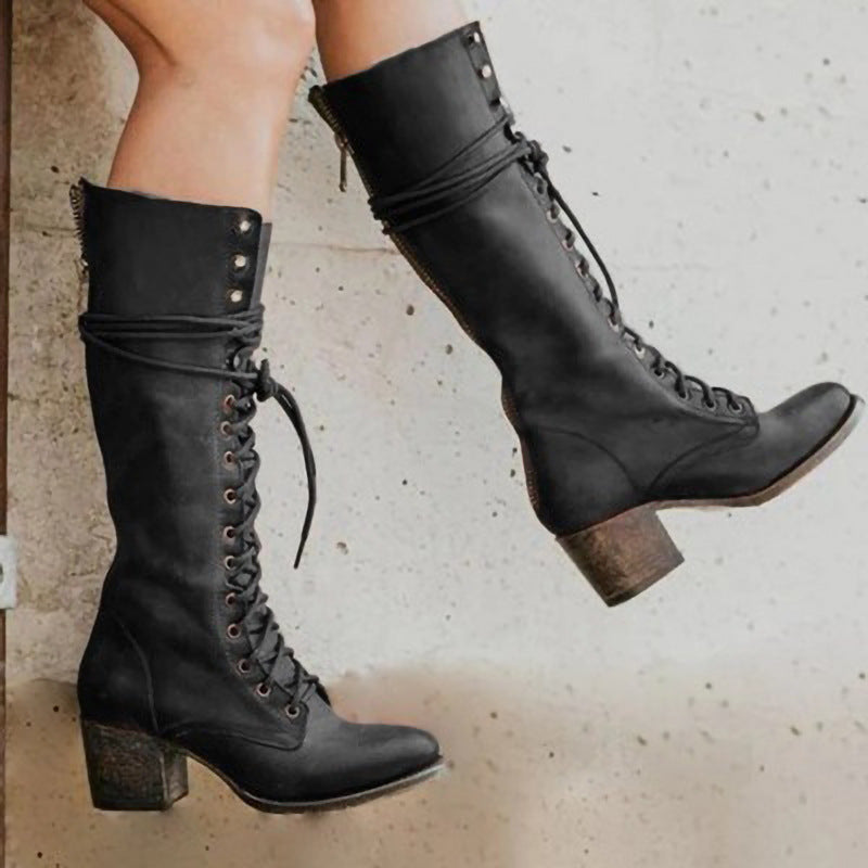 Elegant women's lace-up knee-high boots in classic black, ideal for a sophisticated autumn look.