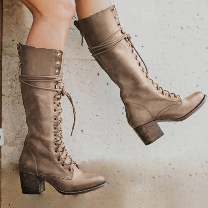 Trendy women's tall boots with full lace-up detail, offering a stylish and comfortable fit.