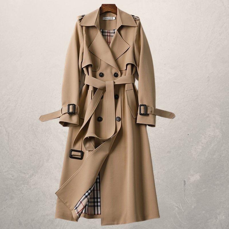 Chic women's double-breasted belted trench coat. Modern long outerwear for versatile layering.