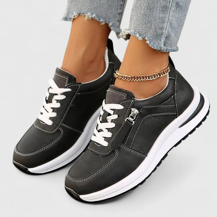 Stylish women's walking shoes with elegant design, practical zipper closure, and cushioned support.