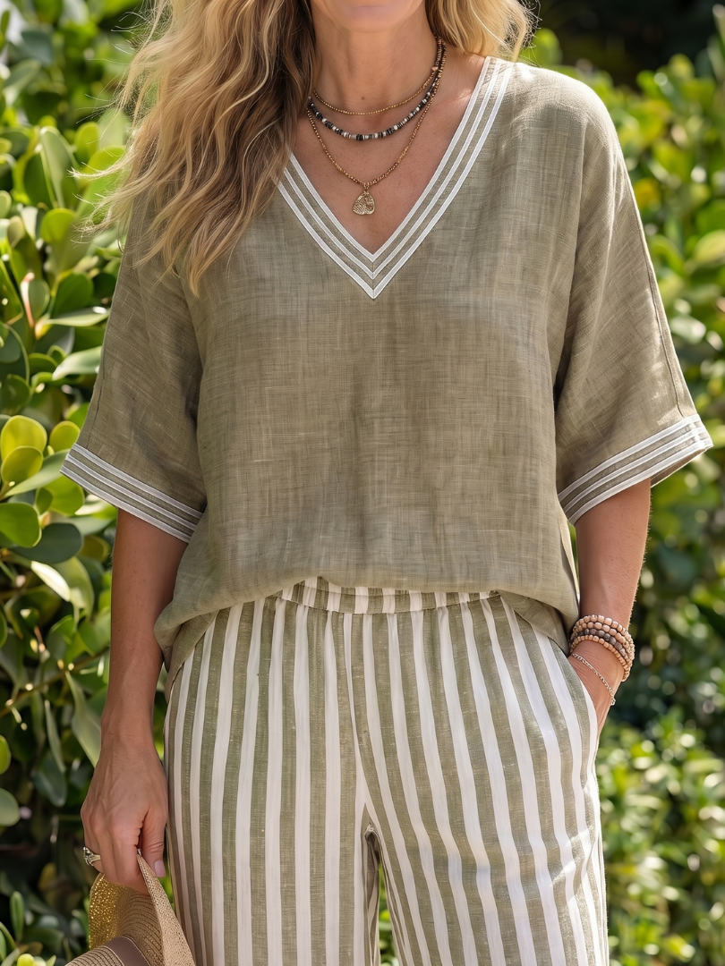 Comfortable women's tunic & striped trousers set with a V-neck, ideal for casual outings.