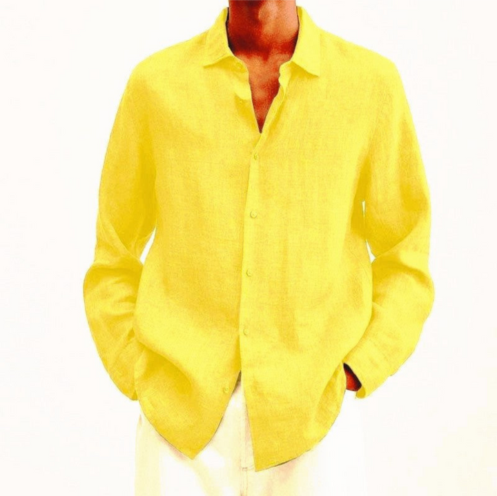 Casual men's long-sleeve button-up shirt, worn untucked for a relaxed and comfortable everyday style.