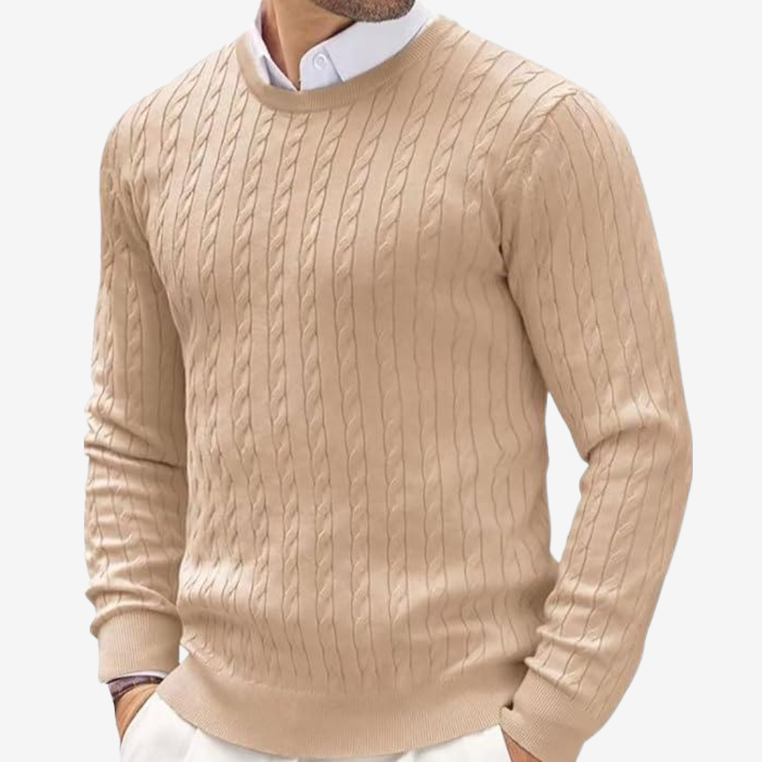 Close-up of the intricate cable knit pattern on a men's crew neck winter sweater. High quality knitwear.