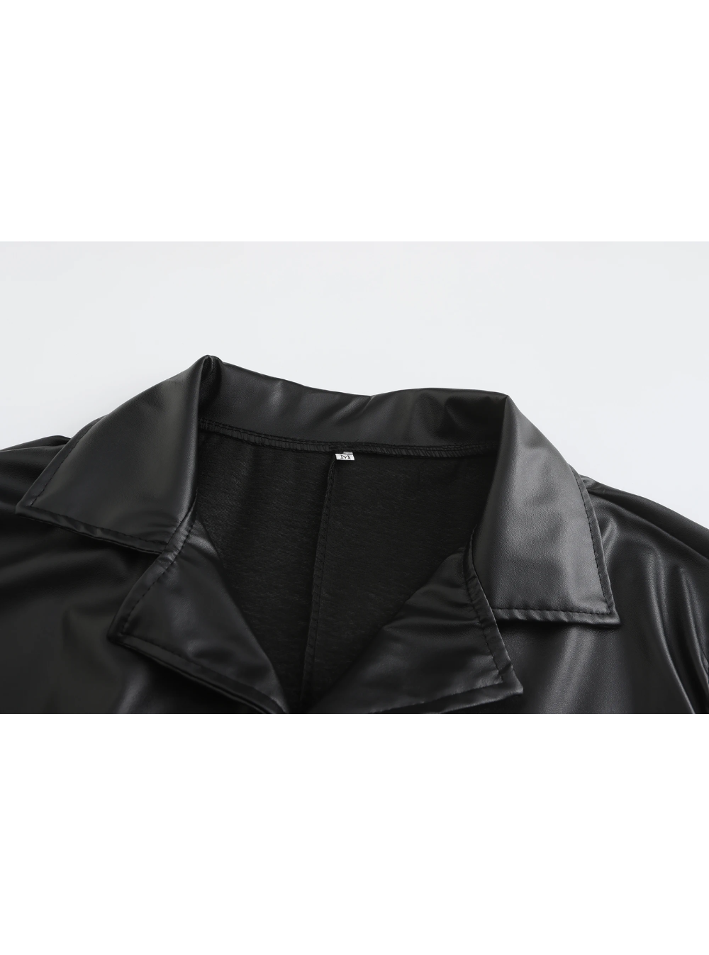 Sleeve cuff detail on men's classic long coat, showcasing elegant and formal styling.