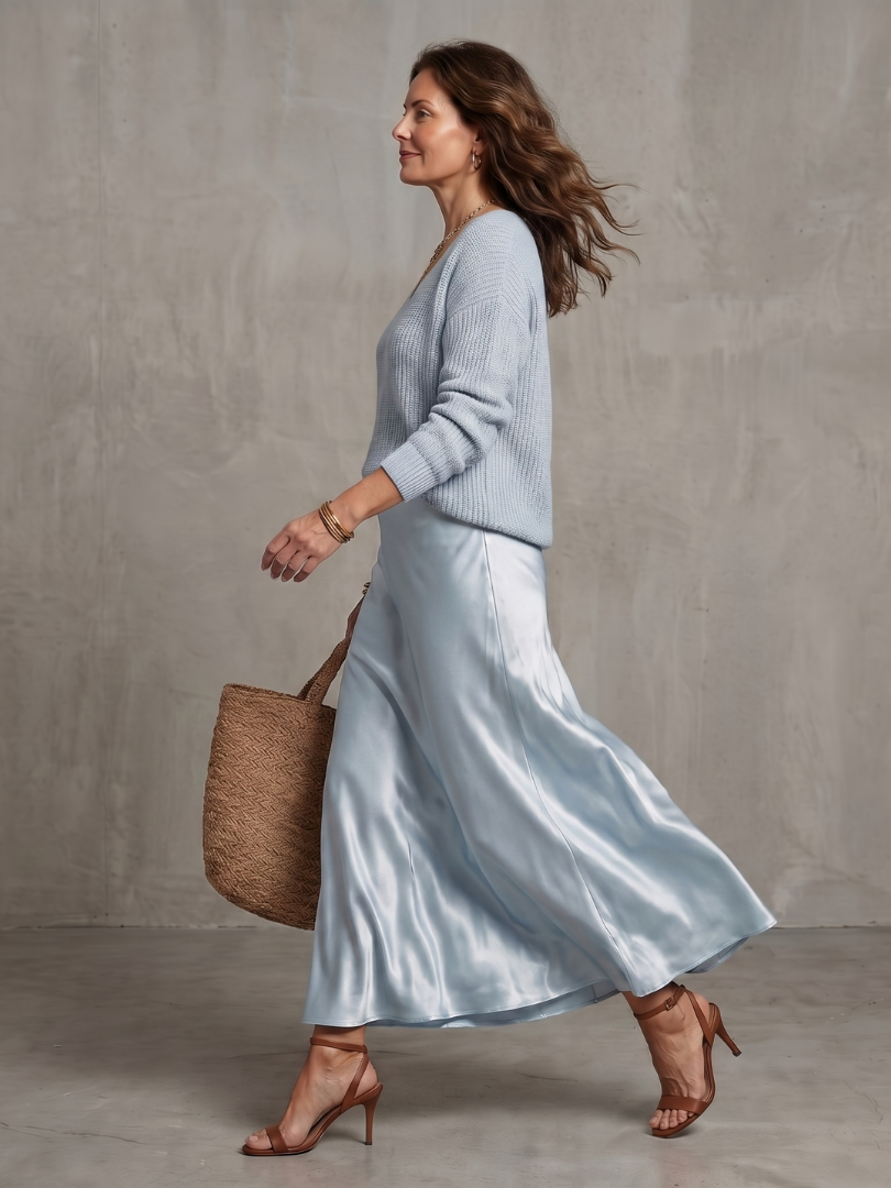 Coordinated women's elegant long sleeve sweater & midi skirt set. Perfect for versatile fall fashion.