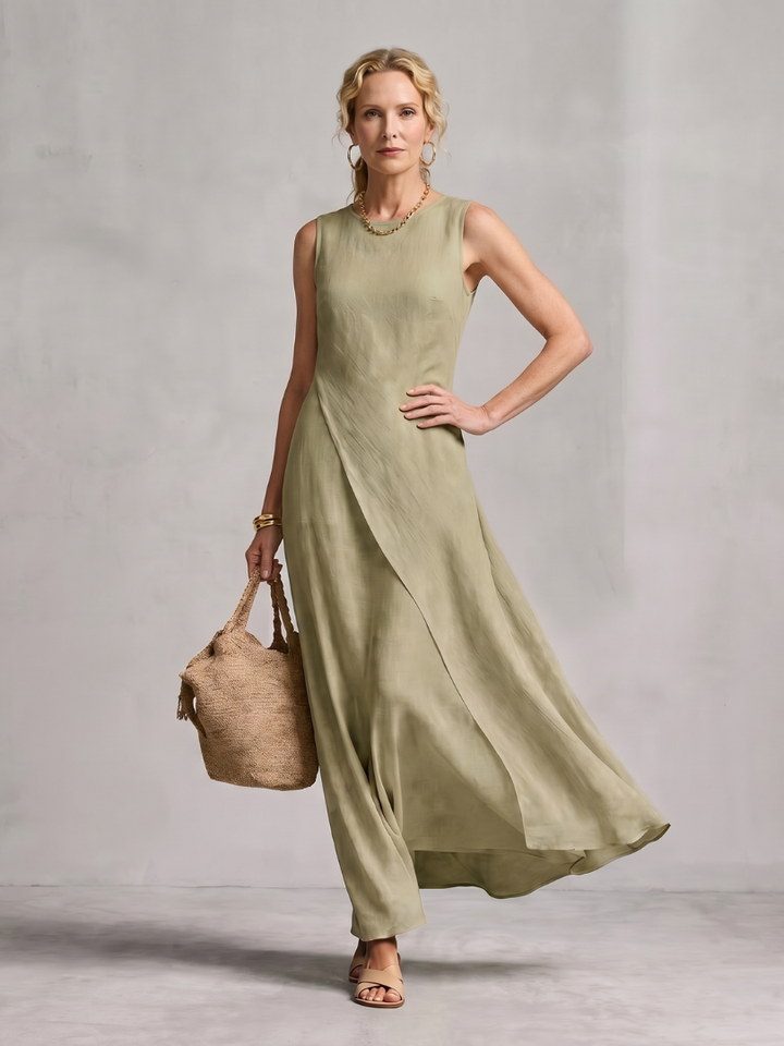 Full length view of a women's flowy asymmetric layered maxi dress with a round neck, perfect for summer.