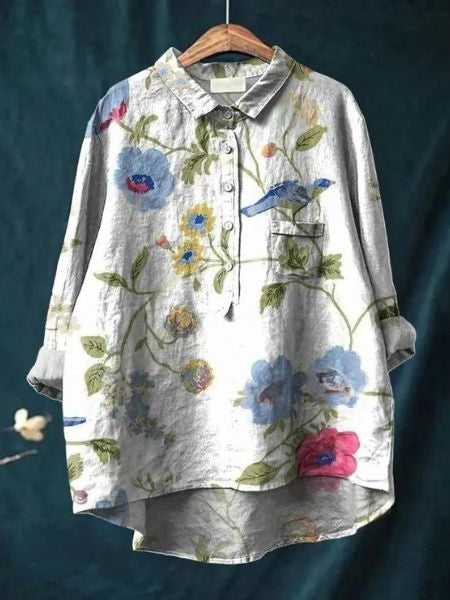 Flat lay: Women's floral print long sleeve button-up blouse, comfortable & versatile top.