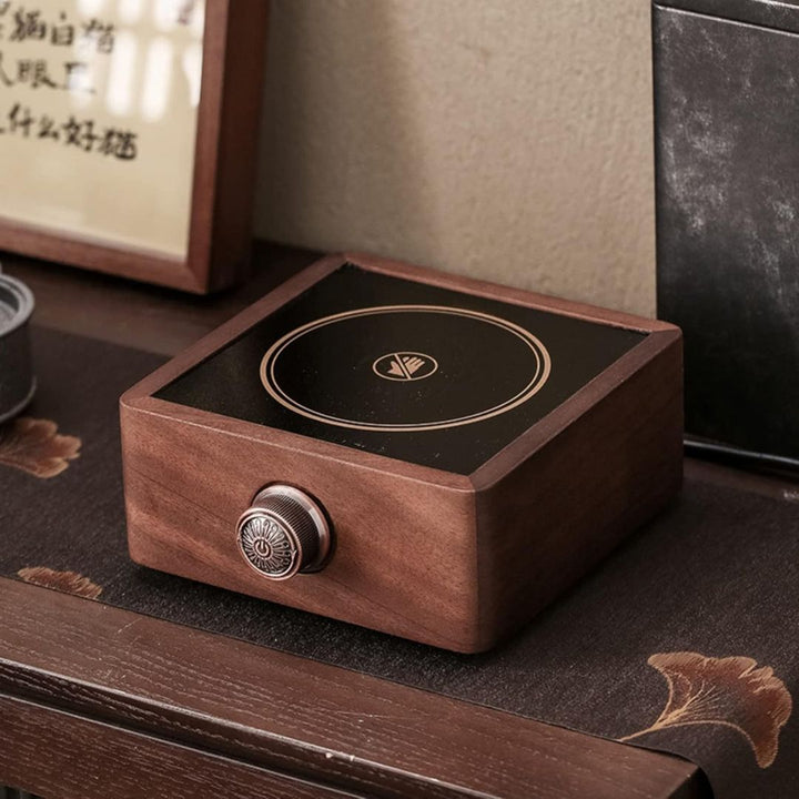 Sleek electric walnut tea warmer for hot beverages, adjustable temp, modern kitchen accessory.