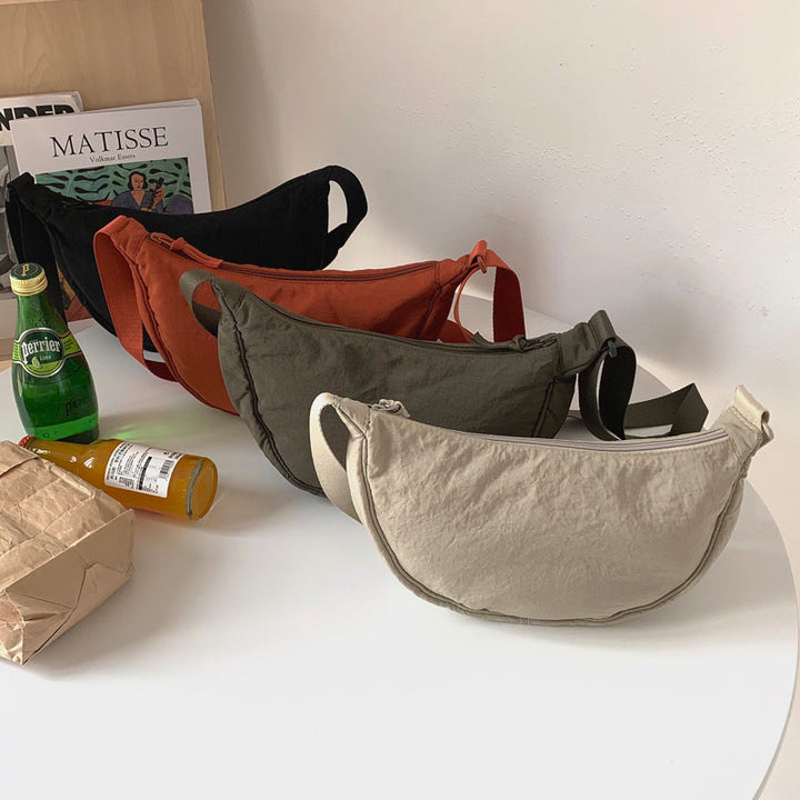 Compact Women's Half Moon Crossbody, a stylish accessory perfect for daily errands & travel.