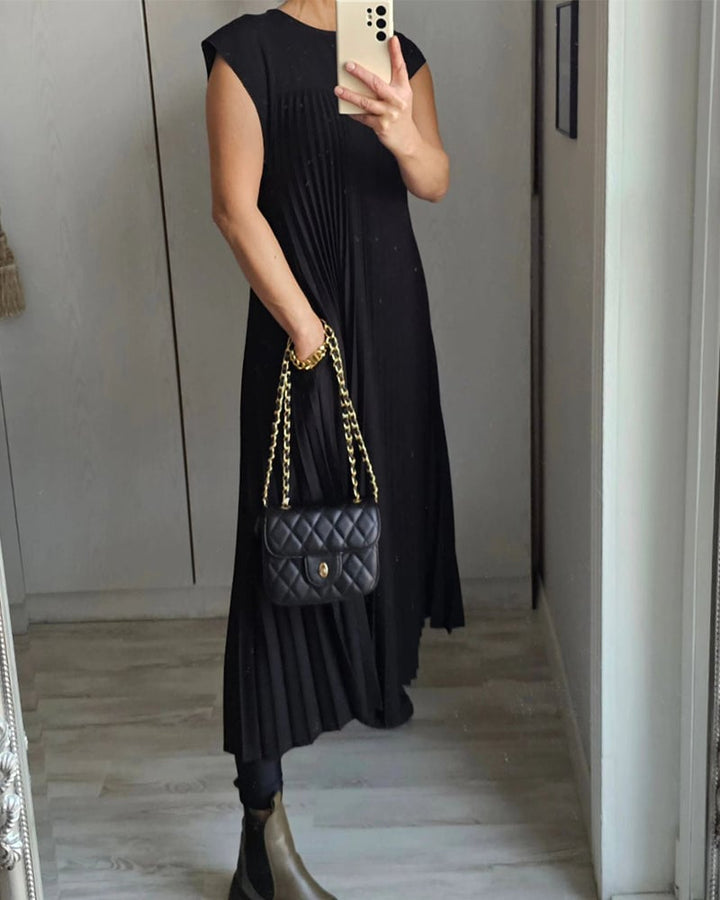 Pleated women's elegant sleeveless dress. Chic and comfortable for warm weather fashion.