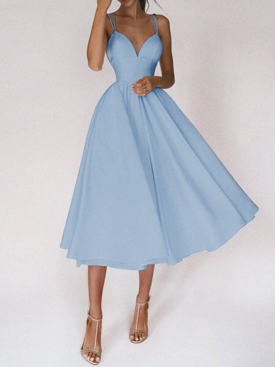 Women's elegant V-neck midi dress with spaghetti straps, a versatile choice for parties & summer.