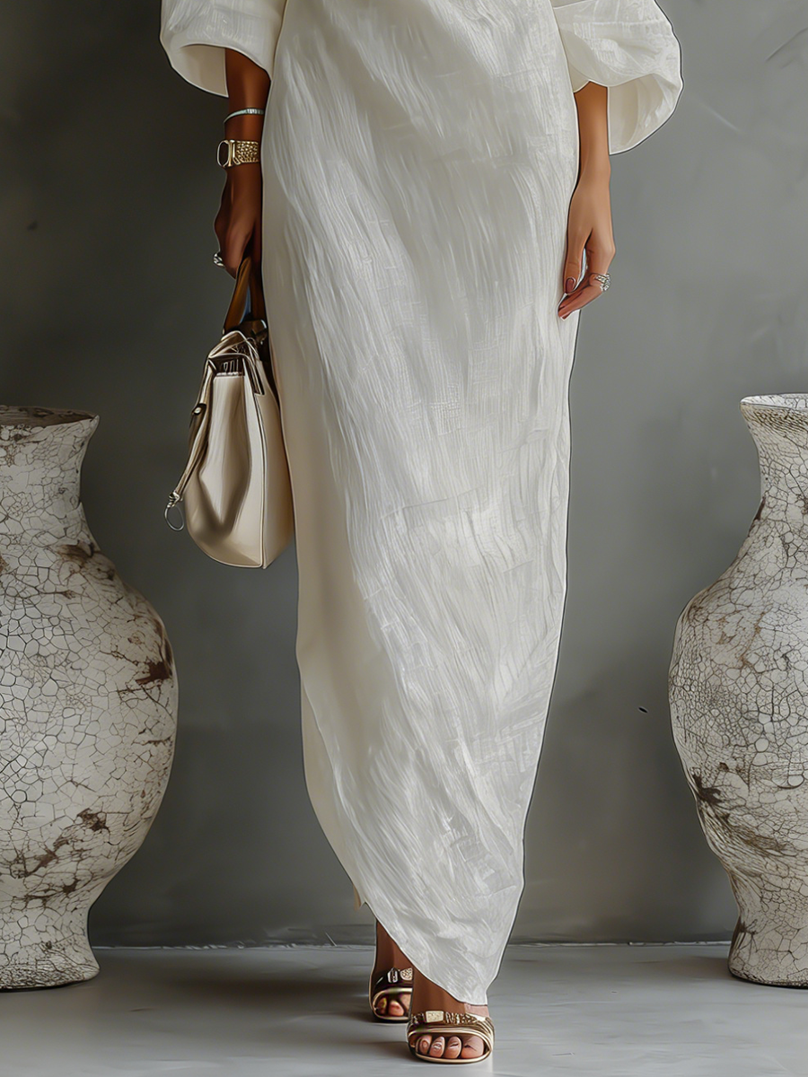 Graceful ivory one-shoulder long maxi dress for women. Elegant, flowing, and perfect as a formal or party gown.