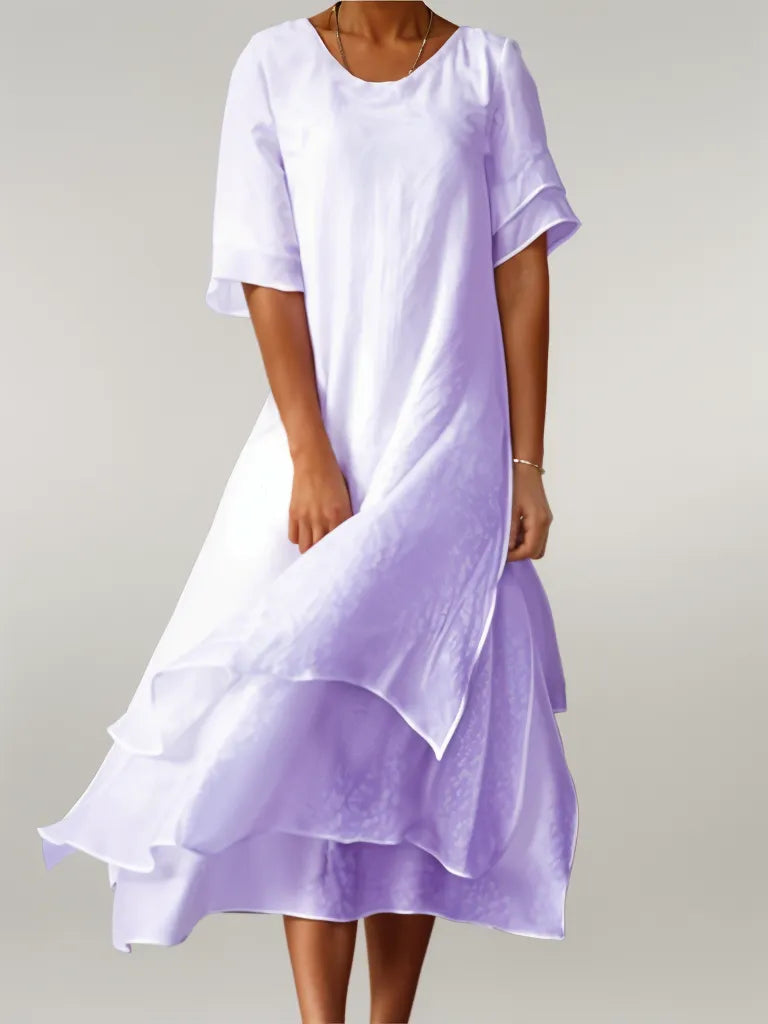 Stylish women's layered midi dress, offering an elegant, flowy silhouette for effortless casual or formal looks.