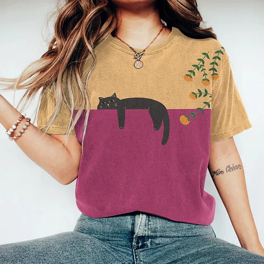 Stylish women's two-tone t-shirt with a unique cat graphic print. A comfortable short sleeve top for women's fashion.