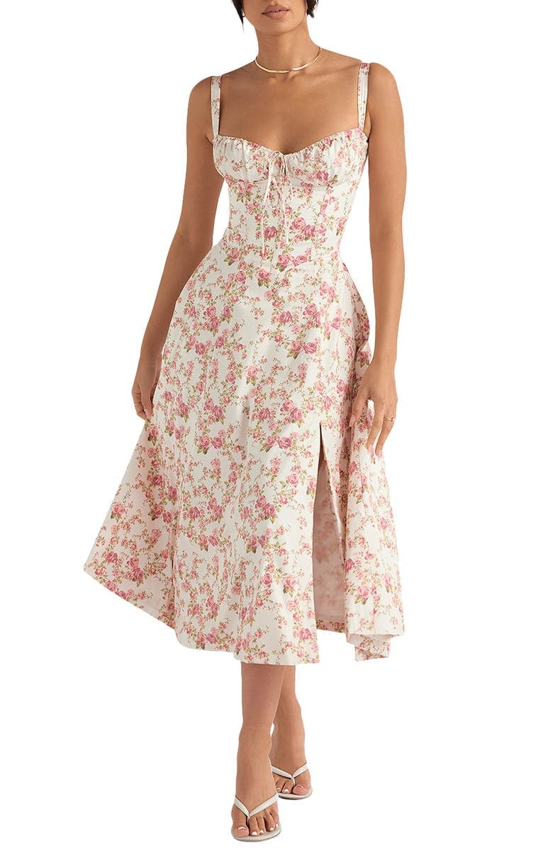 Women's elegant spring midi dress, featuring a vibrant floral print design. Casual or party wear.