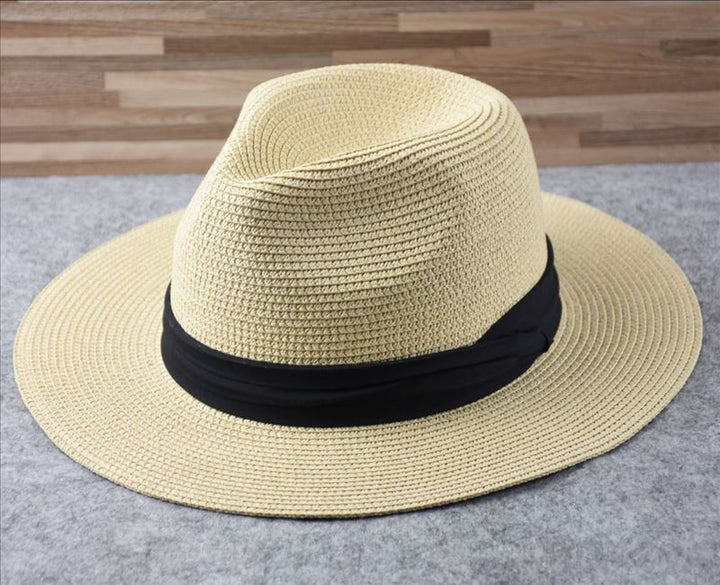 Elegant straw wide brim women's beach hat, a fashionable summer accessory for sun protection & vacation.