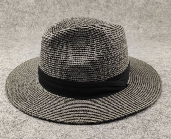 Chic women's wide brim straw beach hat. Perfect adjustable Panama style sun protection for summer vacations.