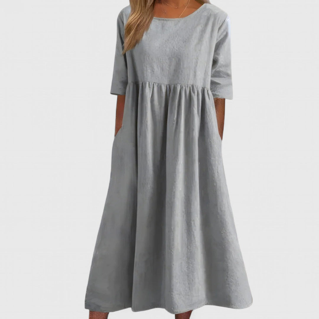 Lightweight and comfortable women's midi dress with a round neck, ideal for elegant everyday summer style.
