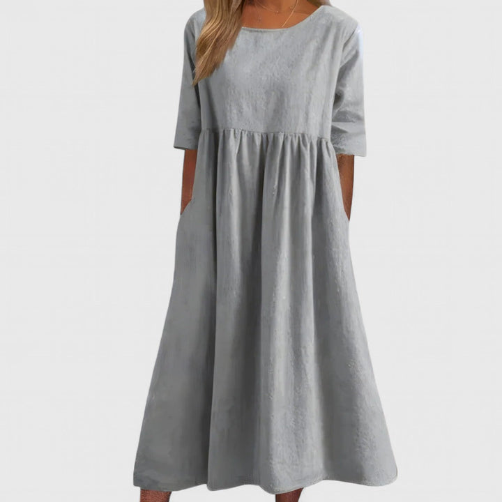 Lightweight and comfortable women's midi dress with a round neck, ideal for elegant everyday summer style.