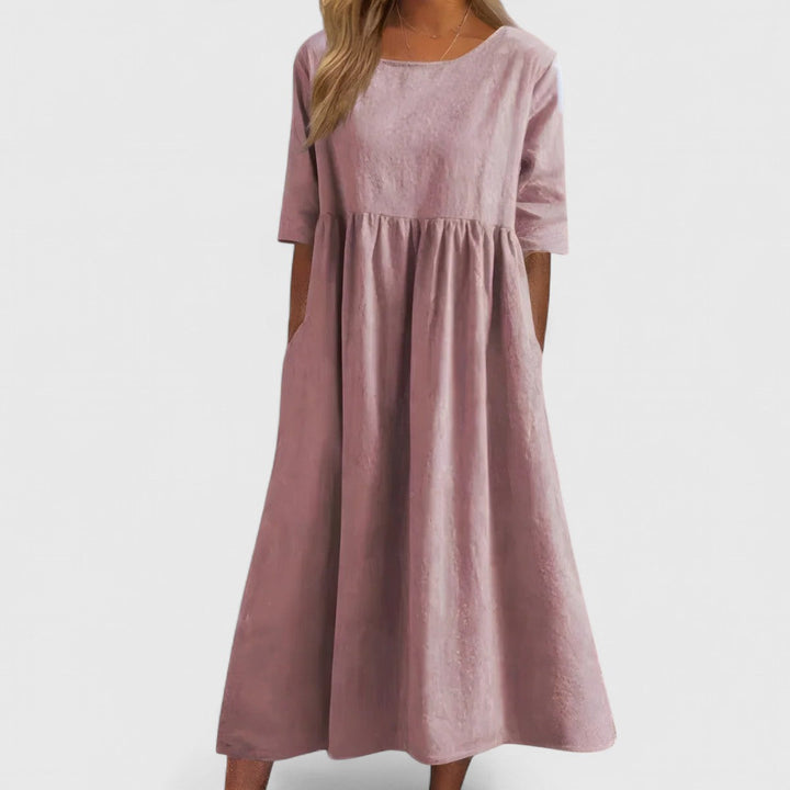 Flattering women's casual summer dress with pockets, elegant round neck, lightweight for everyday comfort.