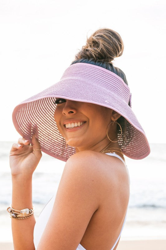 Women's travel accessory: foldable wide brim visor for sun protection, featuring a stylish bow.