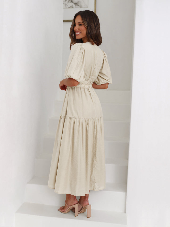 Smocked V-neck midi cocktail dress for women, embodying elegant spring fashion & summer style.