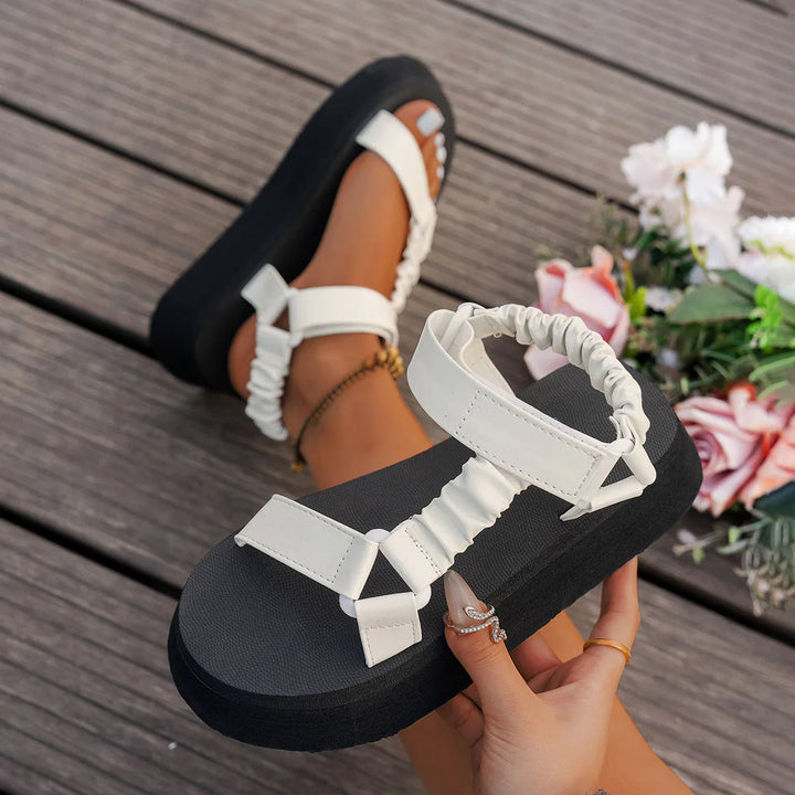 Standout retro 90s iridescent platform sandals with a chunky sole.