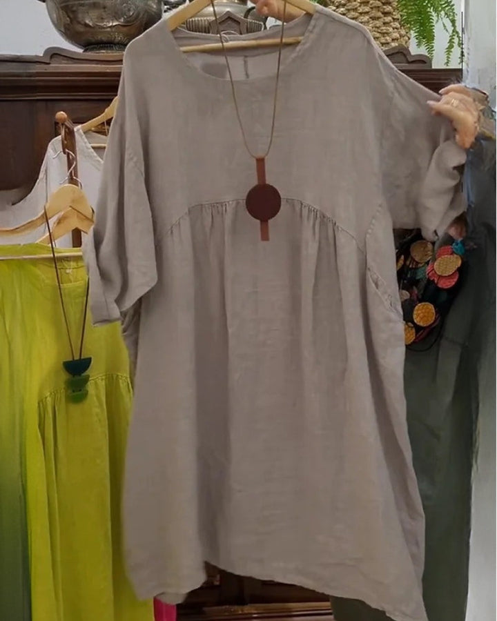 Casual knee-length dress for women, featuring a wide and relaxed fit, ideal for everyday comfort and style.