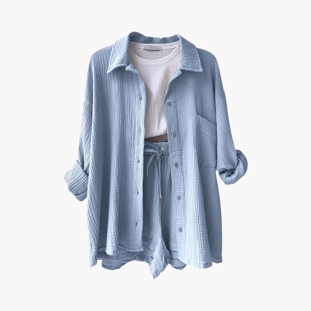 Stylish women's button-down shirt, matching crop top & high-waisted shorts three-piece set. Vacation style.
