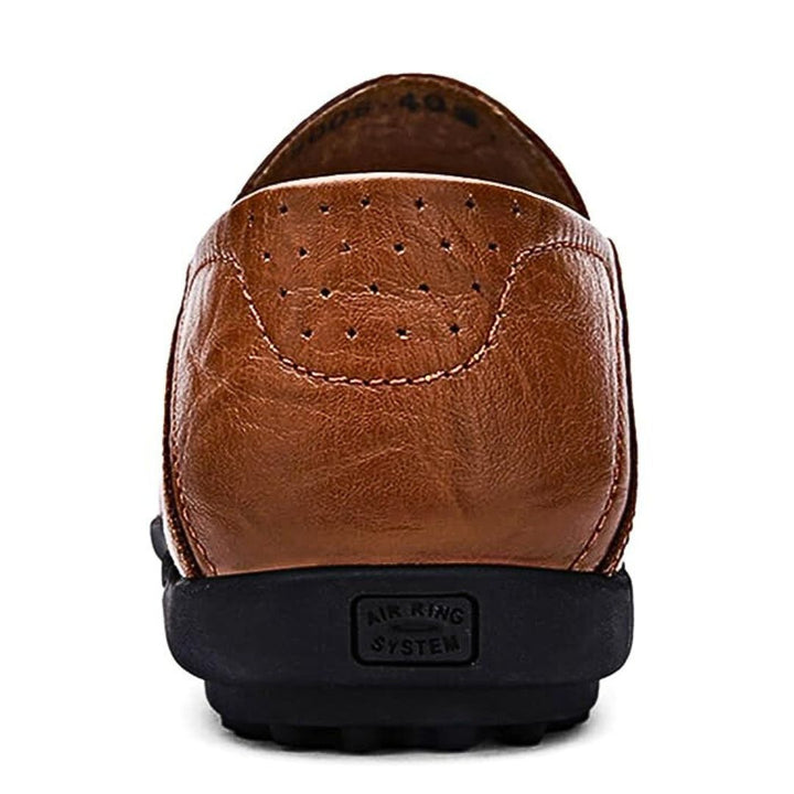 Lightweight men's slip-on loafers with perforated detail, offering comfort for spring and summer walking.