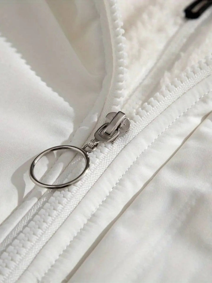 Ladies' fashionable puffer jacket with a luxurious plush-trimmed hood, suitable for travel.