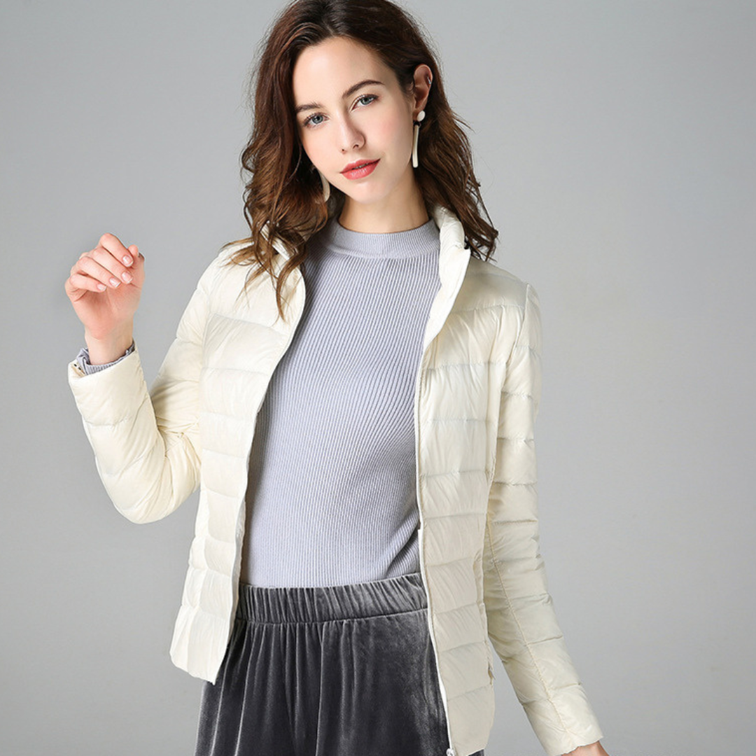 Performance women's ultralight waterproof jacket. Stylish, versatile, and essential for all-weather outdoor adventures.