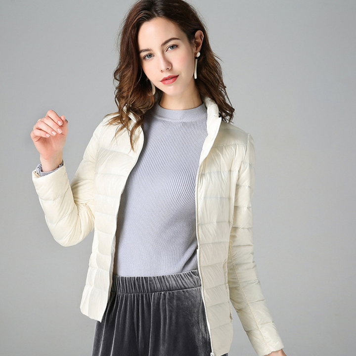 Performance women's ultralight waterproof jacket. Stylish, versatile, and essential for all-weather outdoor adventures.