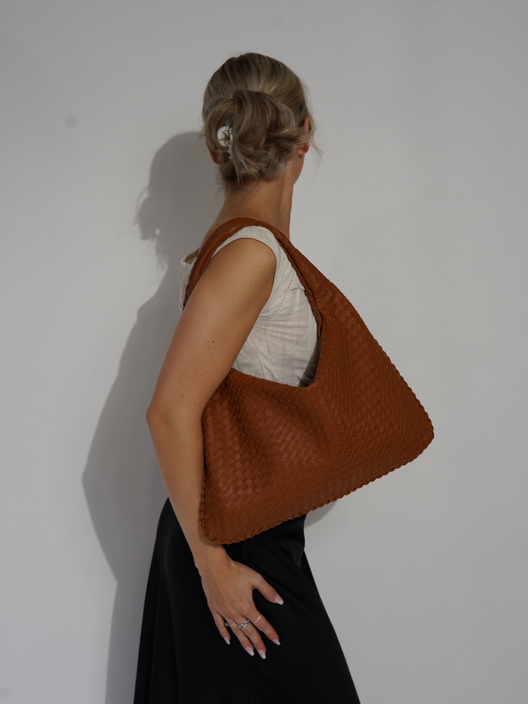 Modern women's one shoulder bag. Stylish vegan leather crossbody accessory.