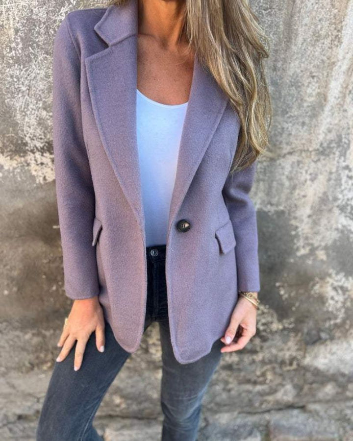 Graceful women's classic blazer jacket, designed for elegant office attire and sophisticated formal events.