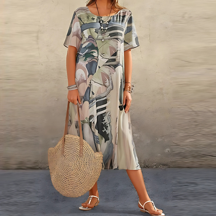 Round neck, short sleeve women's midi dress. Features a unique bold abstract pattern for a fashionable look.