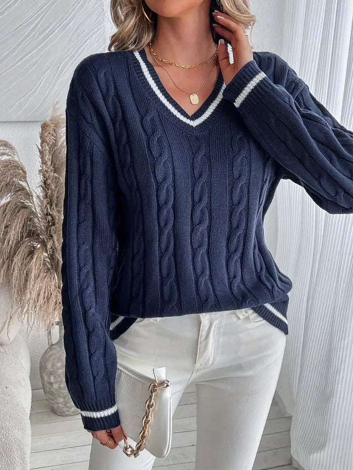 Versatile women's navy cable knit V-neck sweater with striped trim. A chic, cozy top for winter & autumn.