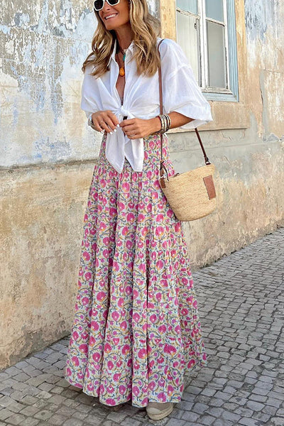 Elegant women's maxi skirt with vibrant boho print. Flowy fabric, great for summer fashion & beach.