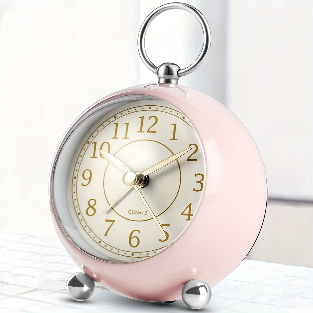 Classic analogue alarm clock with a quiet mechanism & easily readable display, featuring a night light.