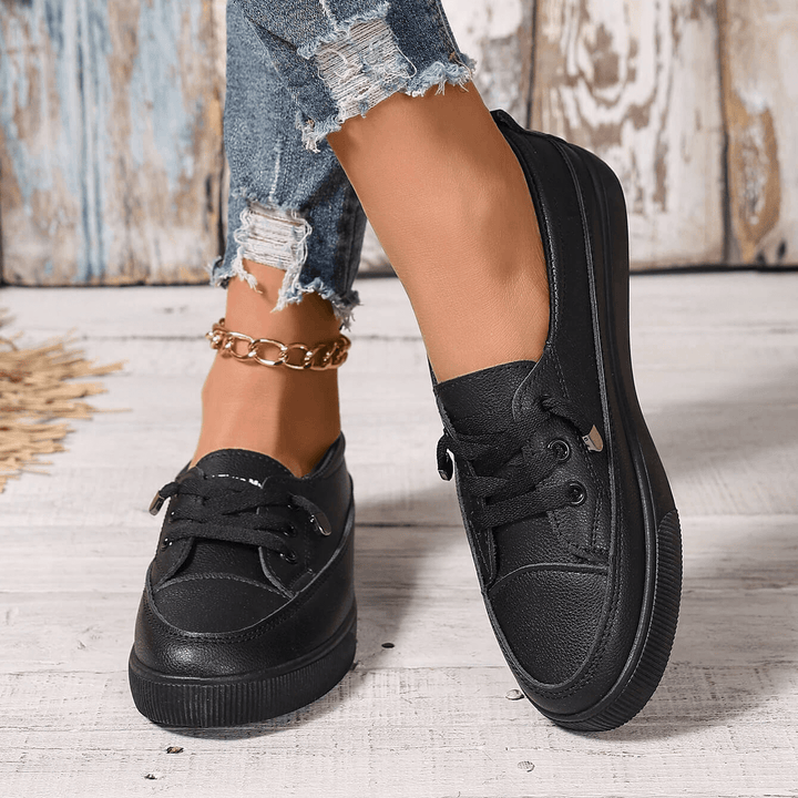 Women's comfortable white sneakers with orthopaedic arch support for everyday wear.