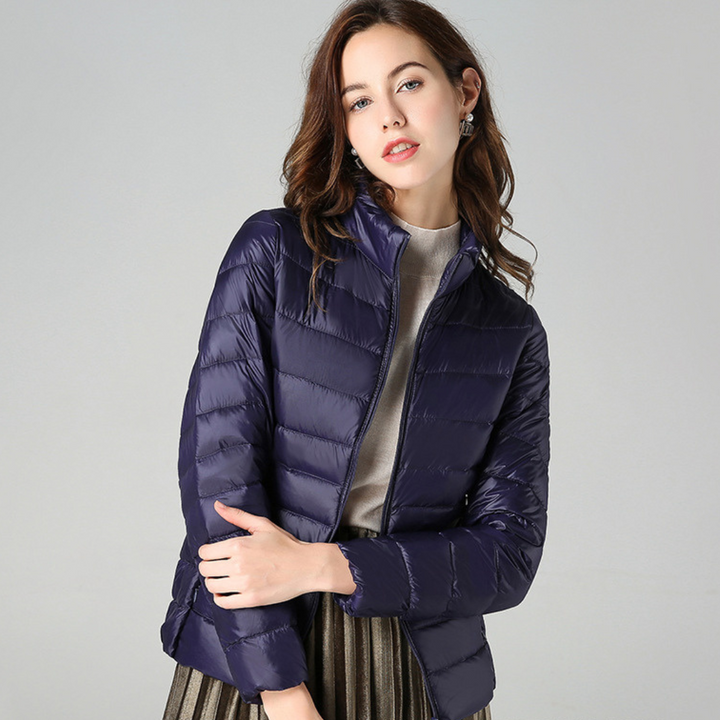 Versatile women's ultralight waterproof jacket for outdoor adventures & casual wear. All-weather stylish rain gear.