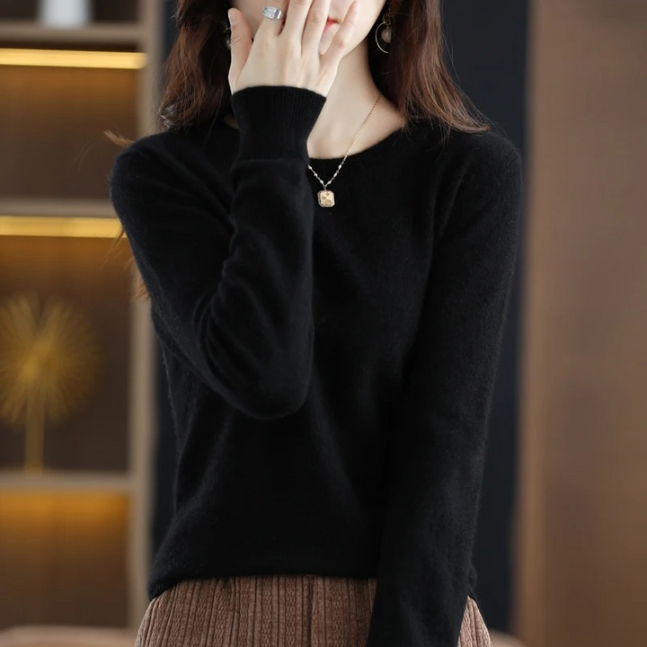 Comfortable round neck women's sweater in a soft, warm knit; versatile for chic casual wear.