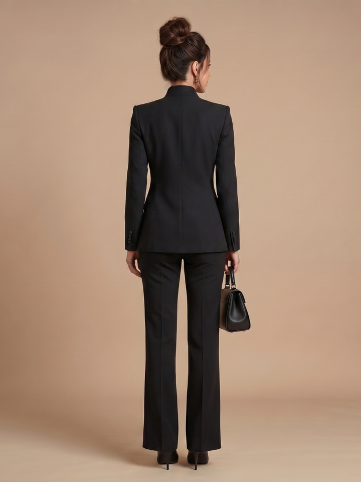Women's elegant tailored suit with a stand collar blazer and fashionable flared leg trousers.