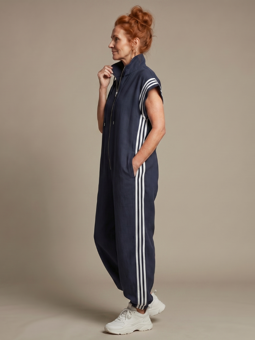 Women's daywear zip front jumpsuit with full-length relaxed fit and modern stripe panels.