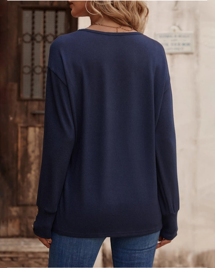 Autumn/Winter women's V-neck long sleeve top, solid color with chic button detailing.