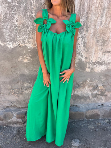 Close-up of the delicate bow straps on a women's elegant U-neck maxi dress, highlighting the unique detail.