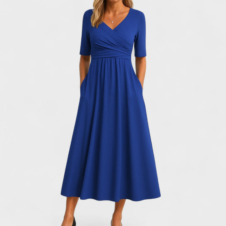 Black V-neck midi dress for women, a versatile and elegant choice for work or casual weekend wear.