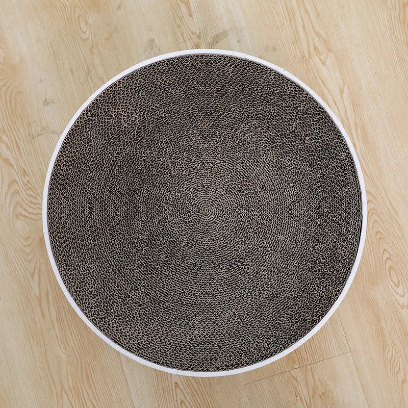 Eco-friendly round cardboard cat scratching mat for effective claw care & furniture safeguarding.