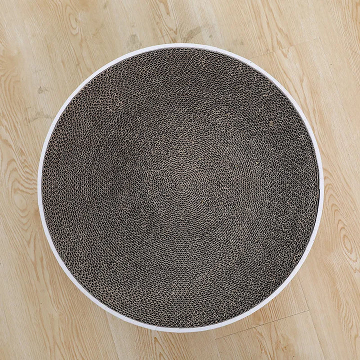 Eco-friendly round cardboard cat scratching mat for effective claw care & furniture safeguarding.
