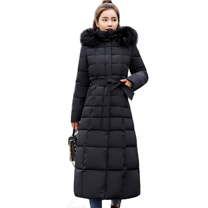 Essential women's long quilted parka, hooded and belted, perfect for winter adventures and daily wear.